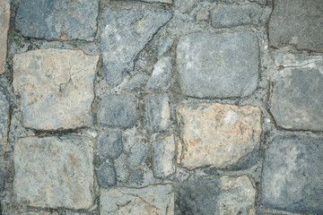 Old cobbles pattern, cobblestone texture, close up view, stone background.