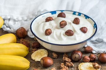 Serving of White Yogurt with  Muesli, Banana and Nuts