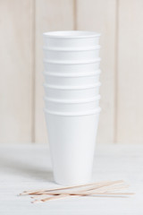 Stack of disposable caps and wooden sticks