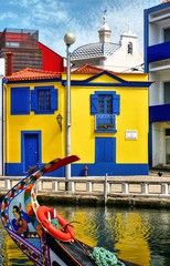 Colorful houses and typical boats in Aveiro, Portugal..