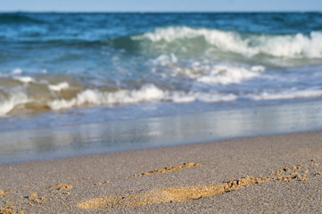 Surf and waves on the sandy shore of the Black Sea on a sunny summer day, Bulgaria, Primorsko