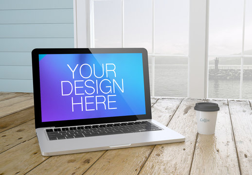 Laptop on Desk with Seaside View Mockup