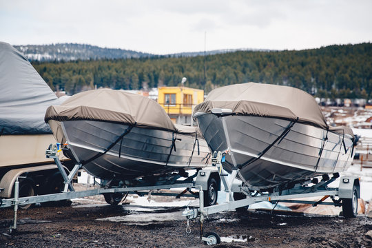 Shrink Wrapped Power Boat In Autumn Woods