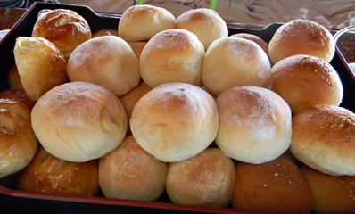 Fresh batch of assorted breads A tray of assorted freshly baked bread provides nourishment for a day.