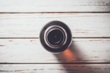 Beer bottle on an old white wooden table