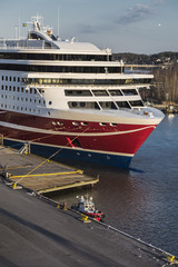 Large sea ferry and a small fire boat