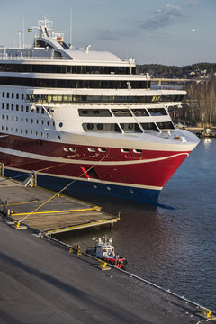 Large Sea Ferry And A Small Fire Boat