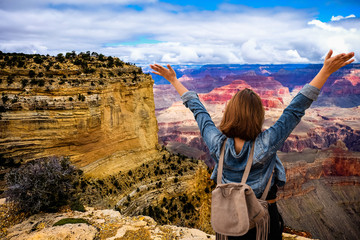 Women tourists wear jacket jeans at sunny light and blue sky at Grand Canyon  National Park , Arizona, USA