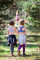Fototapeta premium Two girls walking on nature trail
