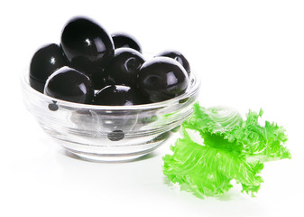 black olives in a glass bowl isolated on white background