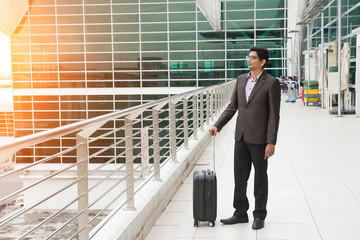 indian male walking at airport