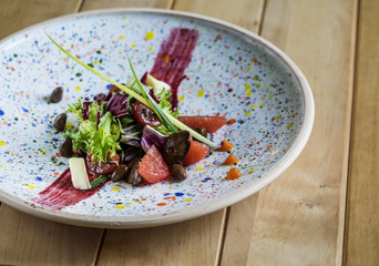 Salad with quail liver