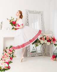 Cute ballerina holding flowers
