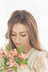 Lovely girl with a bouquet of flowers