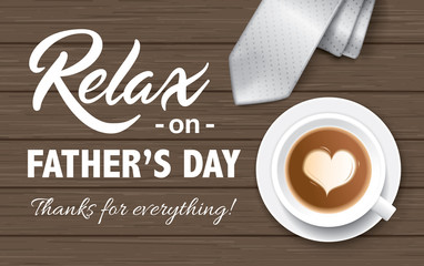 Flat lay style father`s day greeting card with cup of coffee and necktie on wooden table.