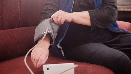 An elderly woman had measured ityself blood pressure