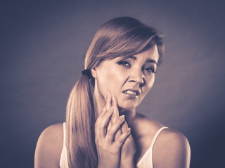 Woman suffering from tooth pain