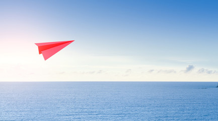 Naklejka na ściany i meble Sea and sky in tourism business concept, 3d rendering of red paper rocket