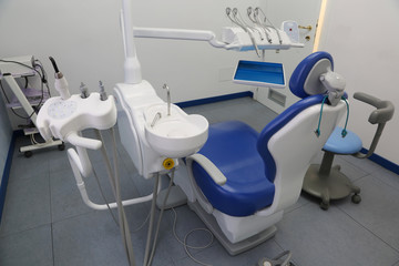 Dental clinic with special chair and dental care equipment photo