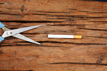 Cigarette and scissors represent stop smoke cigarette concept idea.