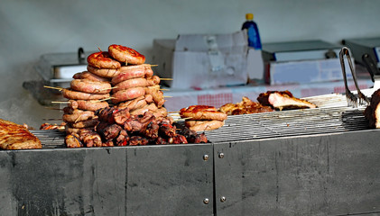 street food stall with big grilled sausages