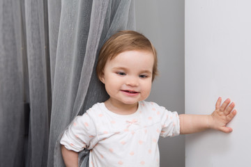 the baby plays in the room