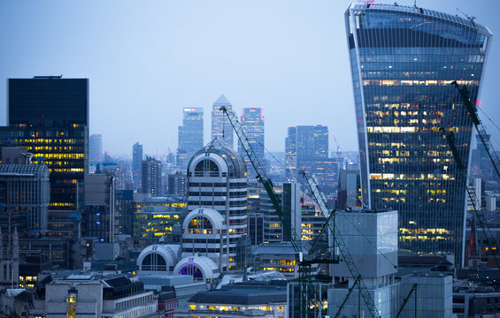 City of London business aria view at night. Walkie-Talkie building and Canary Wharf at the background © IRStone