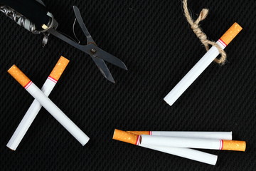 Cigarette and scissors represent stop smoke cigarette concept idea.