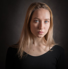 Portrait of a beautiful young woman with blue eyes.