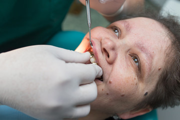 The dentist works with the client in the clinic