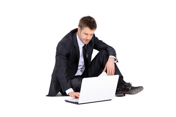Businessman with laptop isolated on white background
