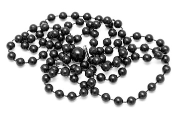 Black beads on a white background