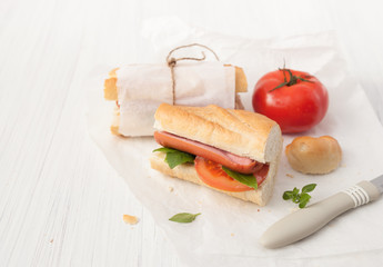 Sandwich with sausage on a white background.