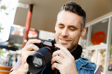 Male photographer taking picture