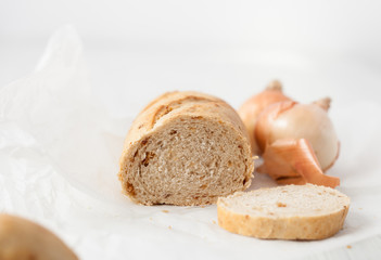 baked onion bread on white table