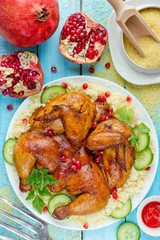 Roast chicken with crispy skin on healthy couscous salad