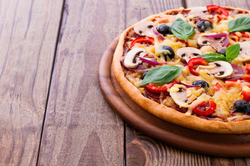 Pizza with seafood on wood table