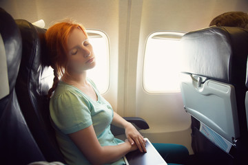 Naklejka premium woman in an airplane