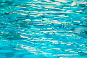 Fototapeta na wymiar The smooth water in the pool as a background