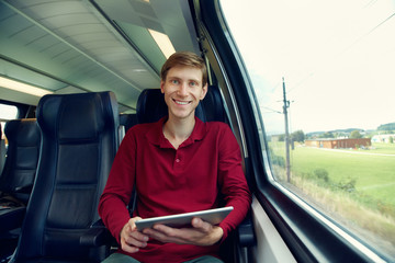 handsome man riding on a train