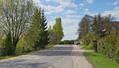 Fototapeta premium The rural asphalt highway up on the hill