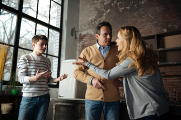 Dishevelled mother shouting at her son