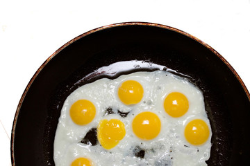 quail eggs fried in a pan