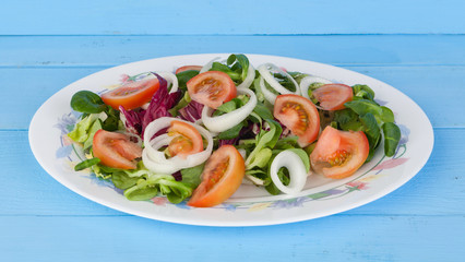 Traditional salad with tomato, lettuce and onion