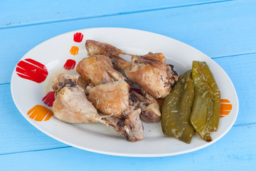 Source of chicken thighs with baked peppers