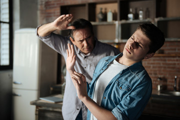Serious boy evading from punishment