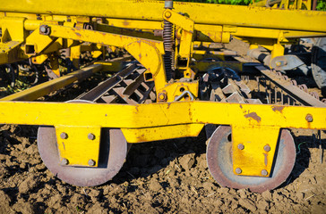 Close-up a plow for soil at agricultural field 