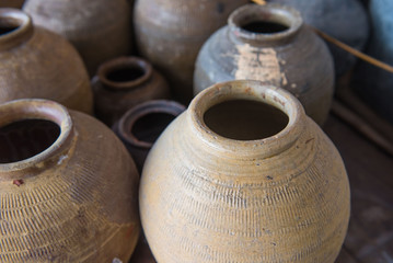 many old jars earthenware from Thailand .