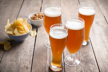 glass beer on wood background