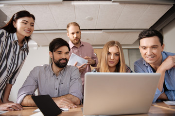 Attentive blonde woman looking at her computer